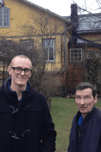 Antti and Tapani in front of Touko Laaksonen's parents' schoolhouse where the artist grew up. in Kaarina.
