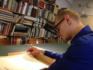 Antti Kauppinen reads through some of Touko Laaksonen's correspondence at Abo Akademi.
