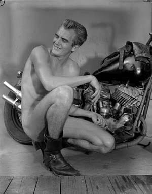 BOB MIZER, Untitled [Ray Hornsby, Motorcycle], Los Angeles, c. 1957, Silver gelatin print. Printed with permission of Bob Mizer Foundation, Inc .
