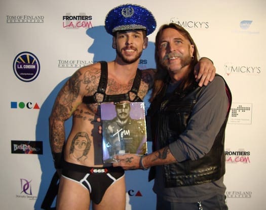 Johnny Blunda receives TOM book.