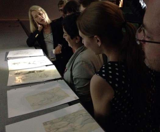 Susanna Luoto, ToFF representative in Finland, at conference showing Tom of Finland originals. Photo from Polly Richards.